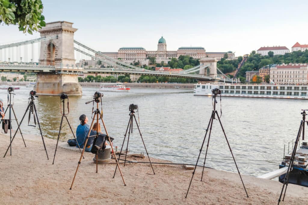 What is the function of tripod in surveying?