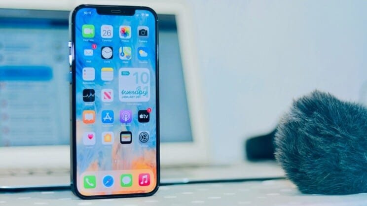 How do I retouch Photos on my iPhone?